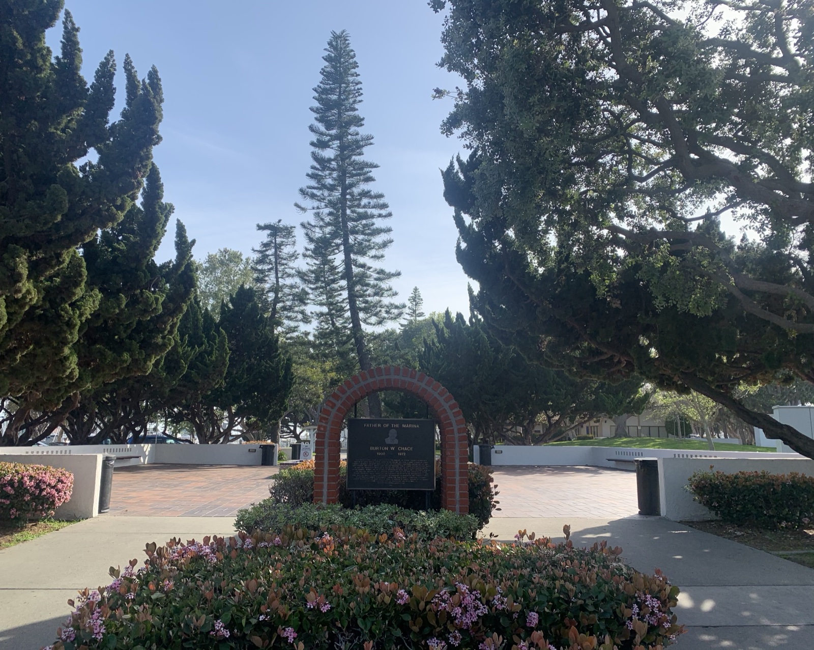 Burton Chace Park in Marina del Rey — lawn and walkways on the point between basins, with masts and moored boats beyond